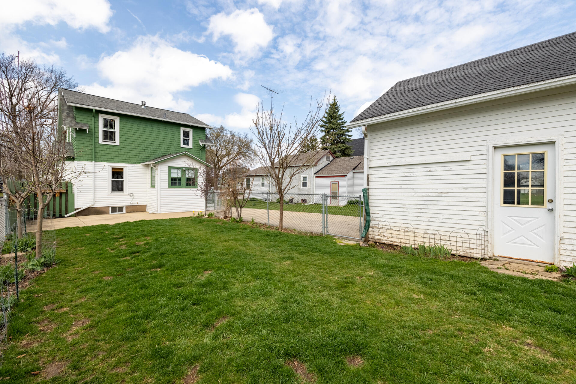 415 South Concord Road Oconomowoc, WI 53066 - Photo 32 of 39 Exterior rear view featuring the house and garage.