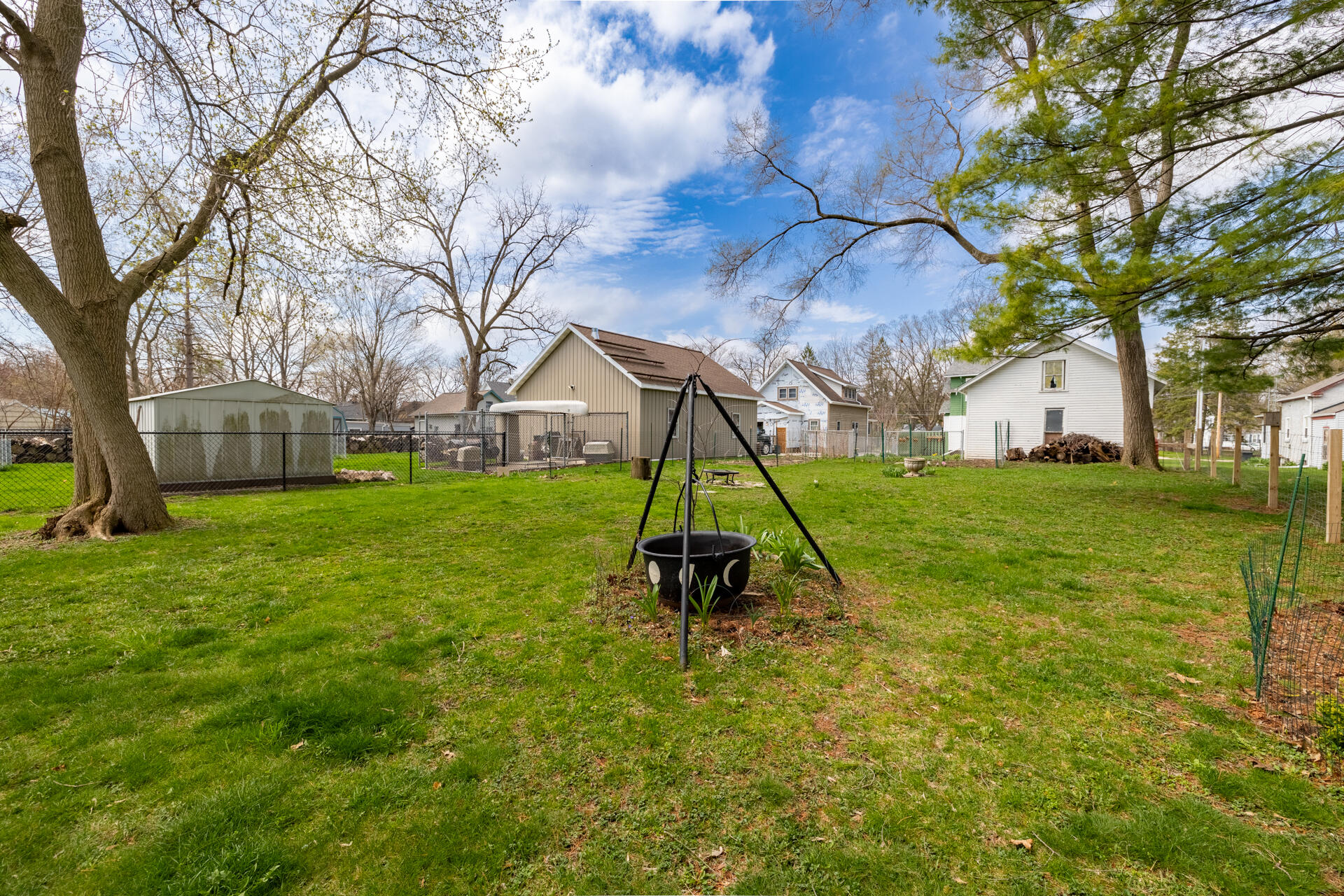 415 South Concord Road Oconomowoc, WI 53066 - Photo 34 of 39 A cauldron is not just for Halloween — it also makes a creative and charming planter.