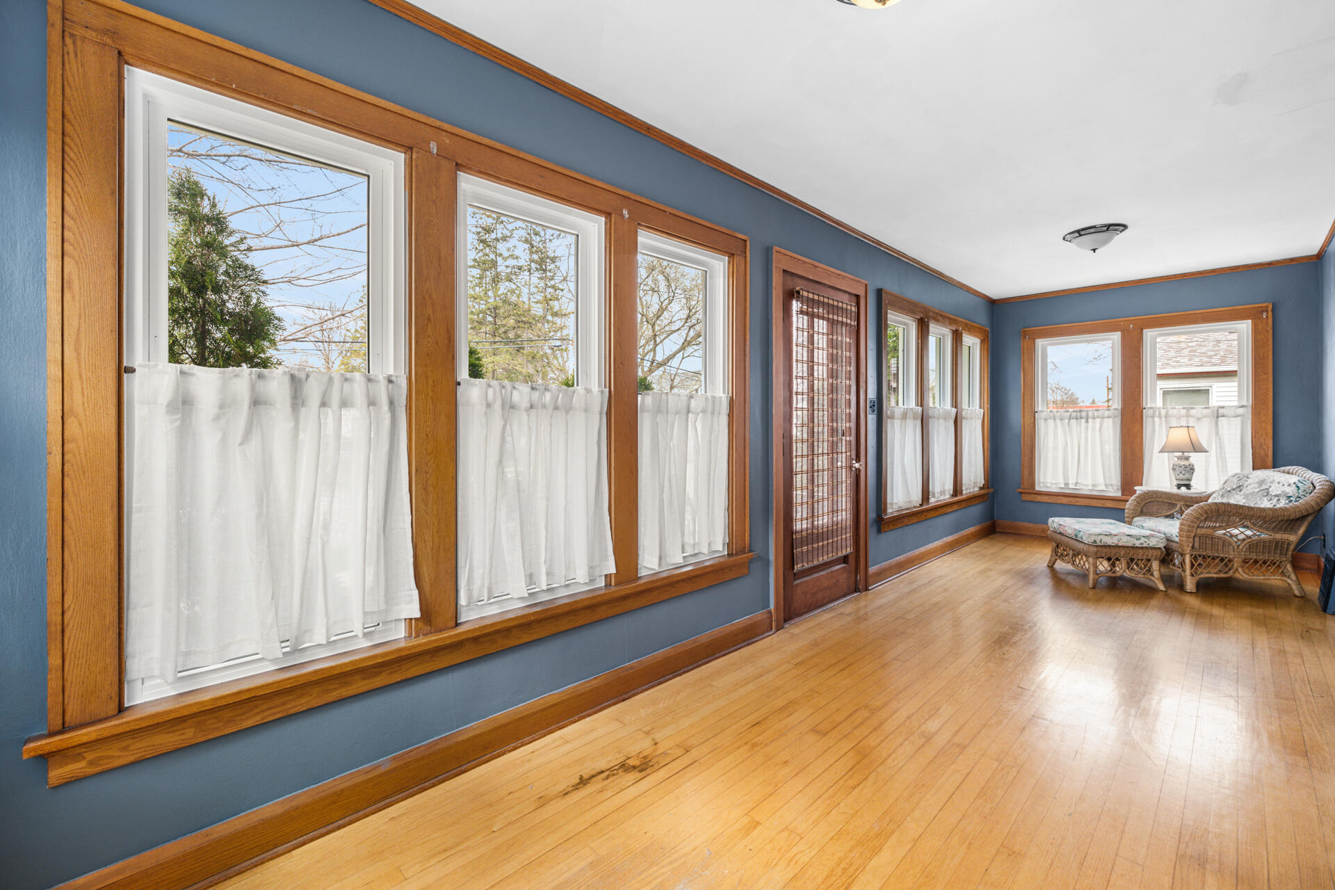 415 South Concord Road Oconomowoc, WI 53066 - Photo 4 of 39 Front door and sunroom create a warm and inviting entry to the home.