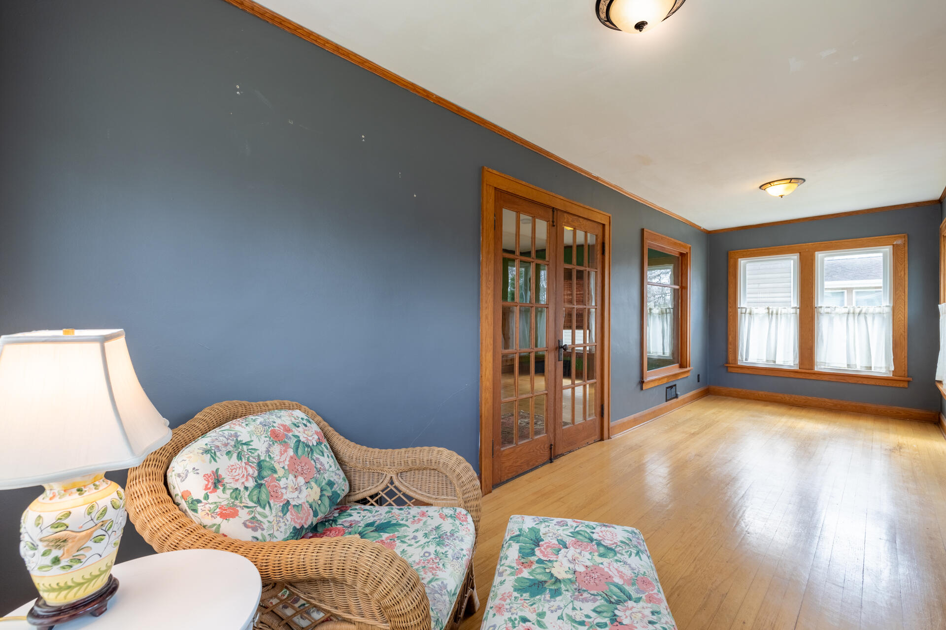 415 South Concord Road Oconomowoc, WI 53066 - Photo 5 of 39 A cozy place to relax and enjoy the warmth and natural light of the sunroom in the afternoon.