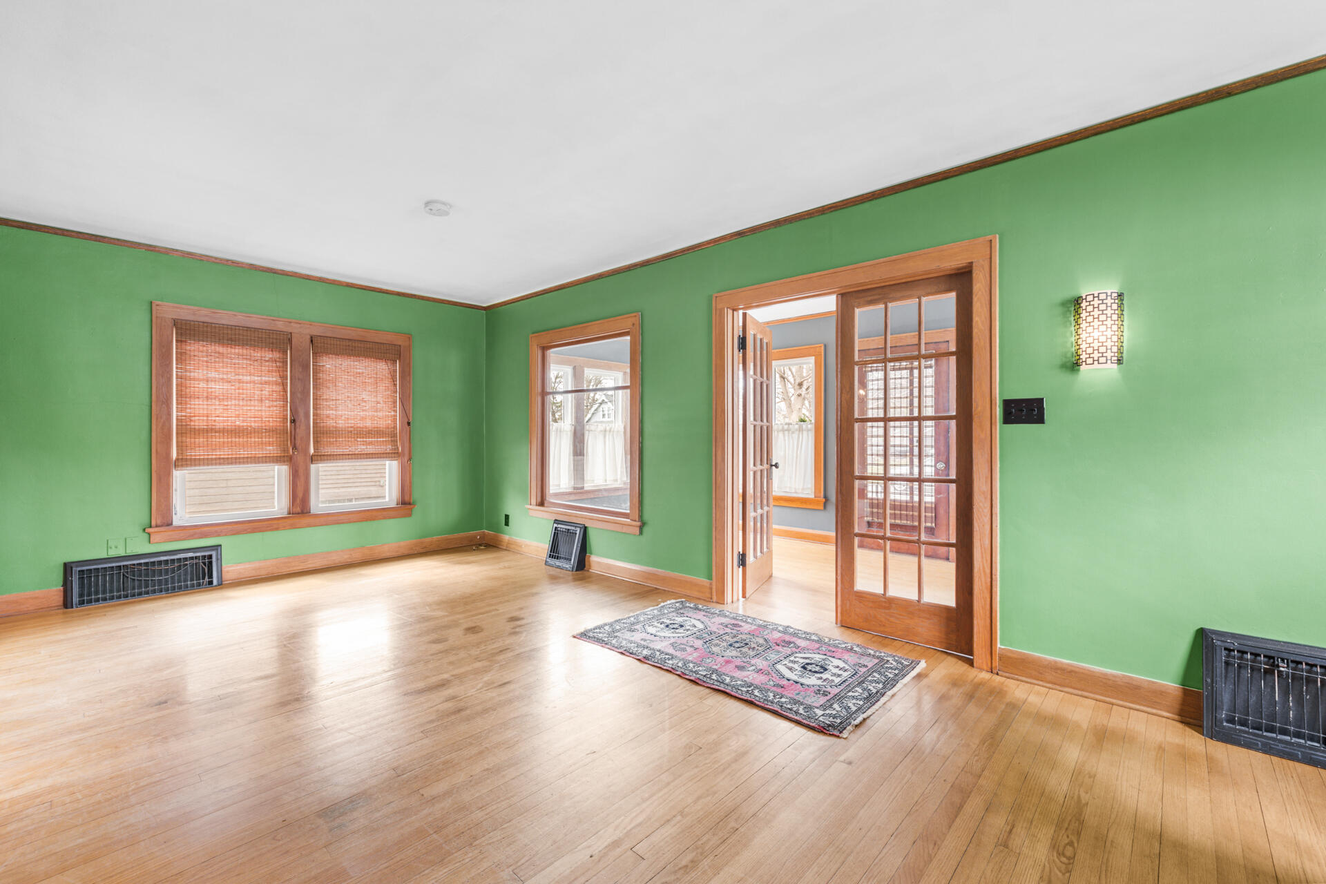 415 South Concord Road Oconomowoc, WI 53066 - Photo 6 of 39 The sunroom creates a welcoming entry as guests make their way into the living room.
