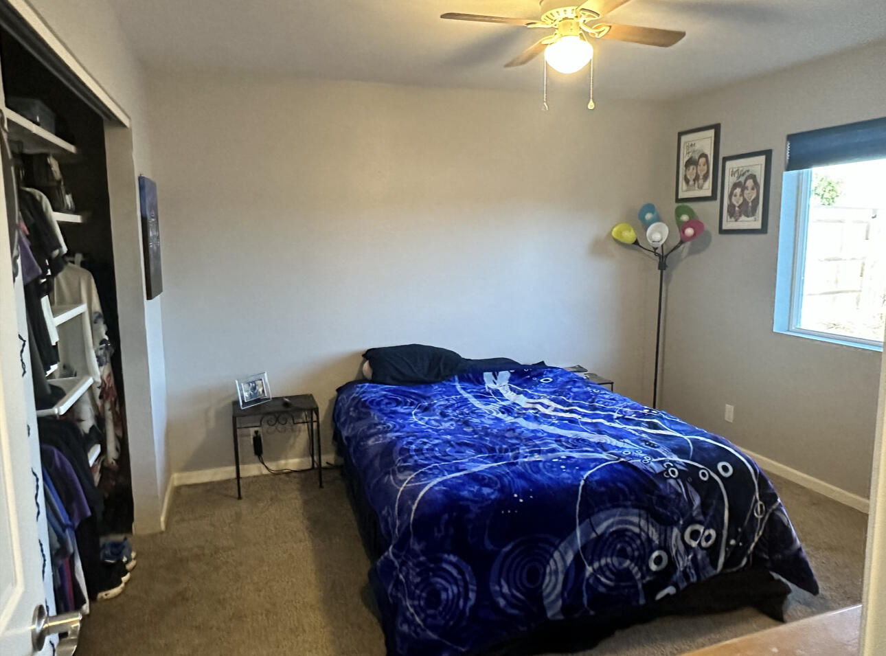 1680 2nd Street Anderson, CA 96007 - Photo 20 of 31 a bedroom with a bed and a chandelier