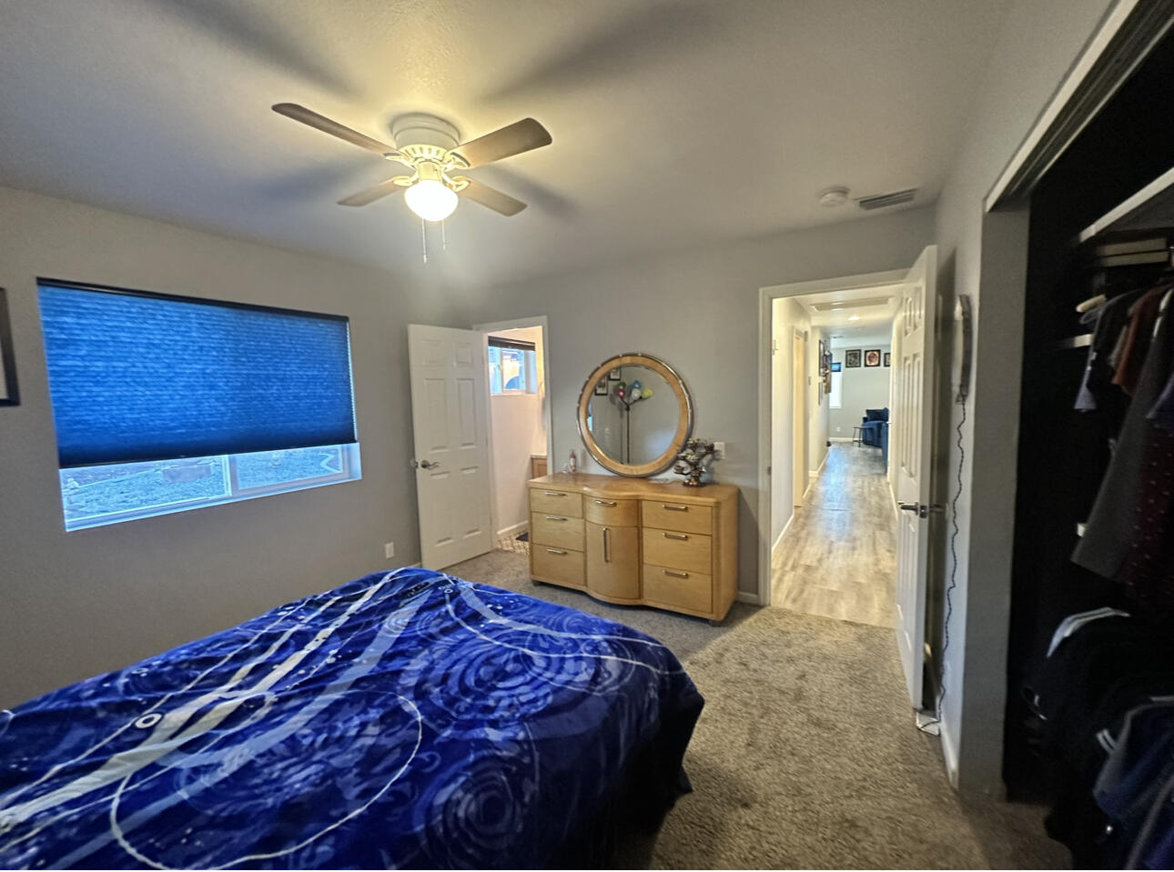 1680 2nd Street Anderson, CA 96007 - Photo 21 of 31 a bedroom with a bed and a chandelier