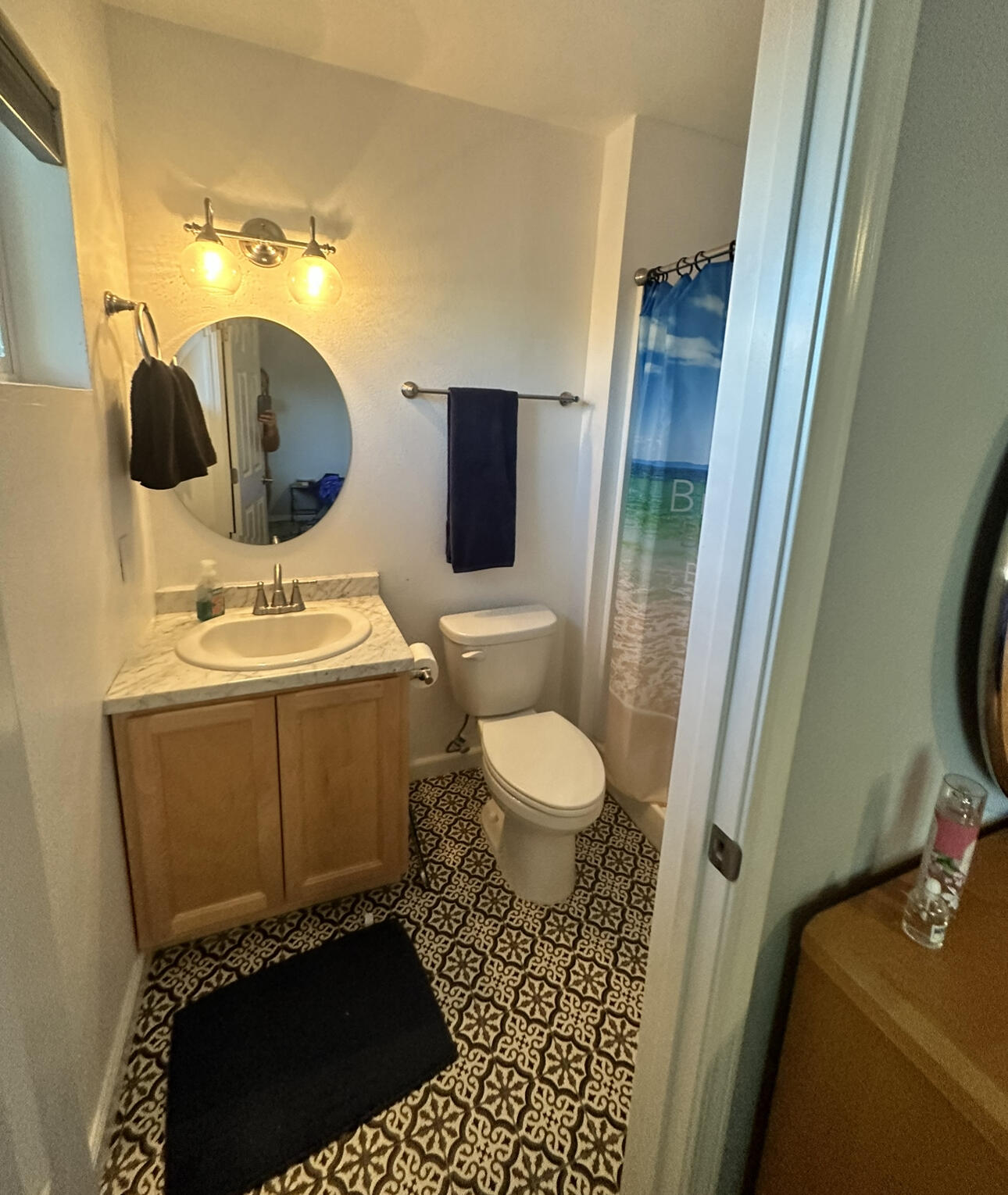 1680 2nd Street Anderson, CA 96007 - Photo 24 of 31 a bathroom with a toilet a sink and mirror
