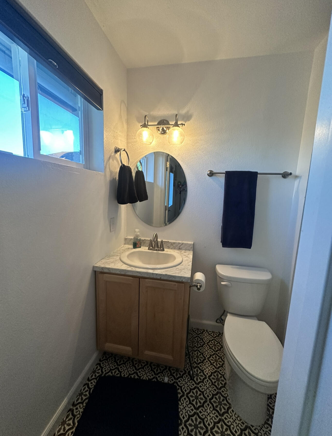 1680 2nd Street Anderson, CA 96007 - Photo 25 of 31 a bathroom with a toilet sink and mirror