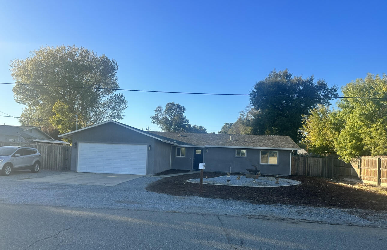 1680 2nd Street Anderson, CA 96007 - Photo 31 of 31 a front view of a house with a yard and garage