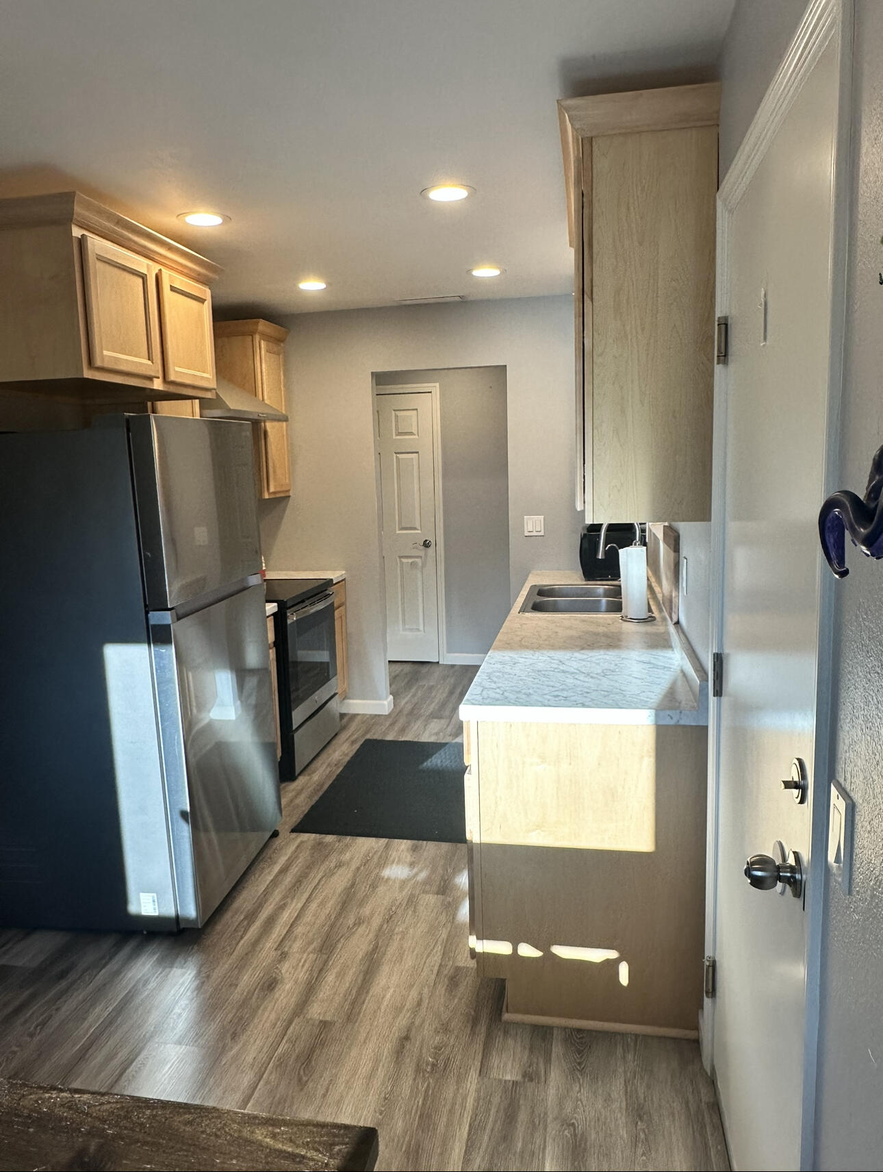 1680 2nd Street Anderson, CA 96007 - Photo 5 of 31 a kitchen with granite countertop a refrigerator and a sink