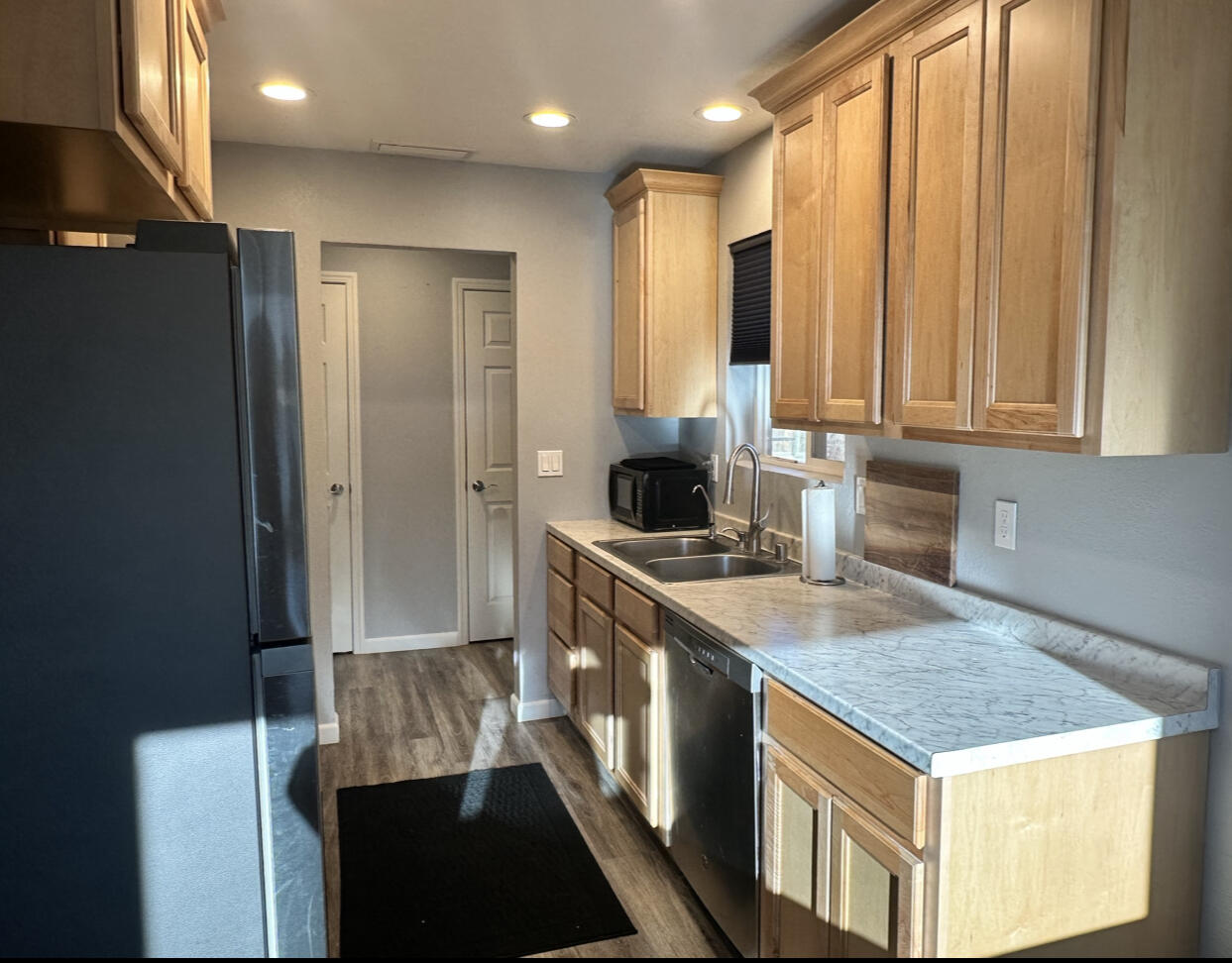 1680 2nd Street Anderson, CA 96007 - Photo 6 of 31 a kitchen with a sink stove and refrigerator
