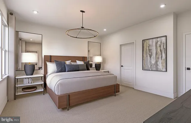 a bedroom with a bed and chandelier