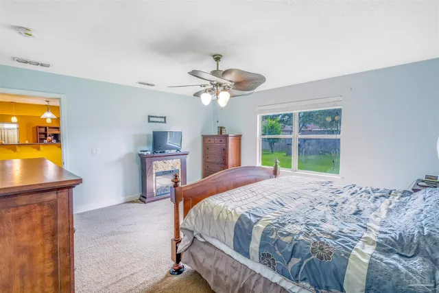 a bathroom with a granite countertop tub sink and mirror