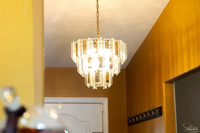 a living room with furniture a ceiling fan and a flat screen tv