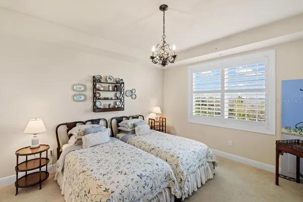 a bathroom with a granite countertop sink mirror and shower