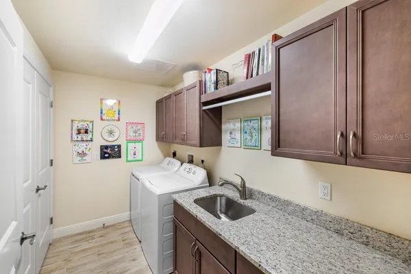 a view of a livingroom with furniture and hardwood