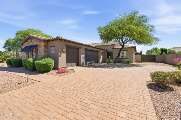 a kitchen with stainless steel appliances granite countertop a stove top oven a sink dishwasher and cabinets with wooden floor