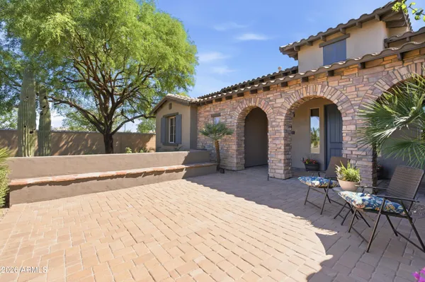 a kitchen with stainless steel appliances granite countertop a granite counter tops and a view of living room