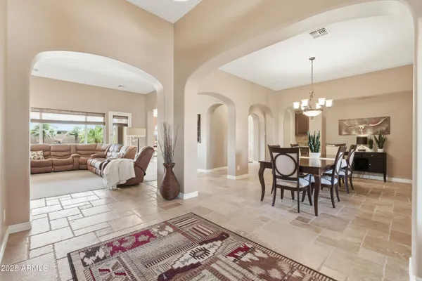 a spacious bedroom with a bed and a window