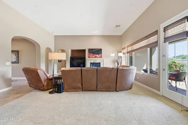 a living room with furniture and a large window