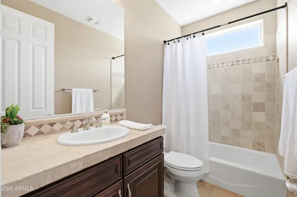 a view of a patio with table and chairs and potted plants