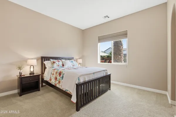 a view of a swimming pool with an outdoor seating and a pathway