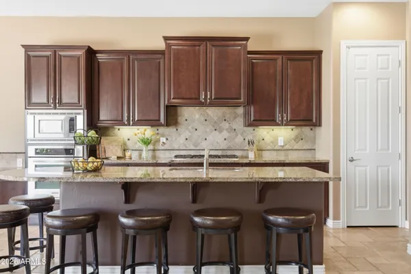 a view of a chairs and table in the patio