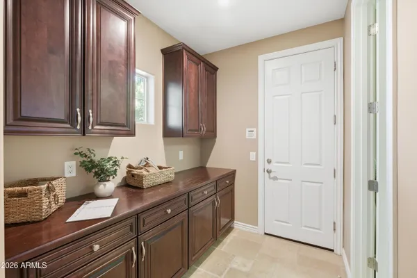 a view of a lake with couches chairs and umbrella