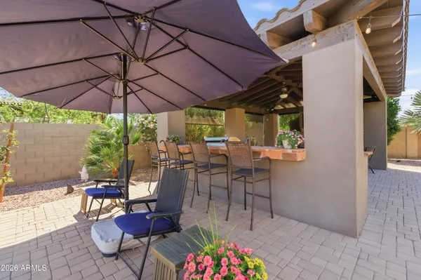a view of a chairs and table in a patio
