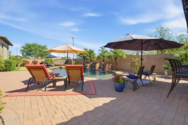 a kitchen with stainless steel appliances granite countertop a sink and stove