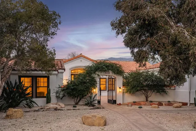 a view of a street with a building in the background
