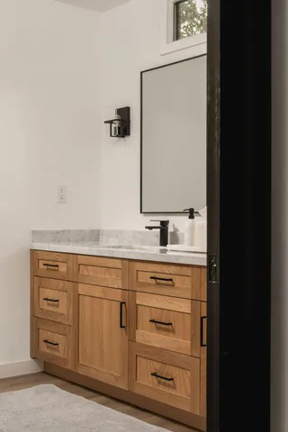 a bathroom with a sink and a mirror