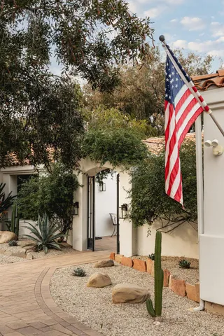 a view of walk in closet with open kitchen