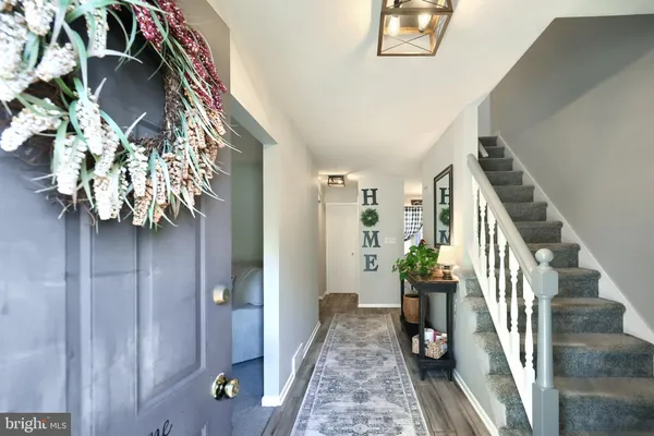 a view of entryway with wooden floor