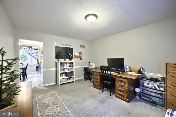 a view of a livingroom with furniture