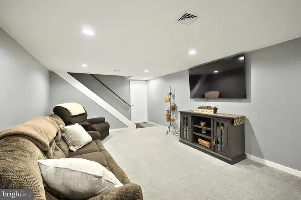 a bedroom with furniture and a dresser