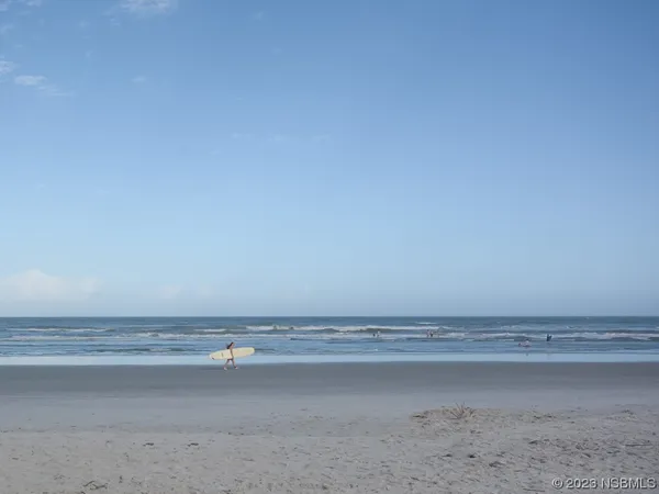 a swimming pool with trees in the background