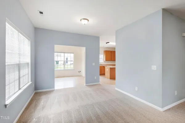 a view of a room with a empty room and a window