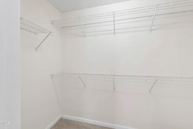 a view of a room with racks on the wall