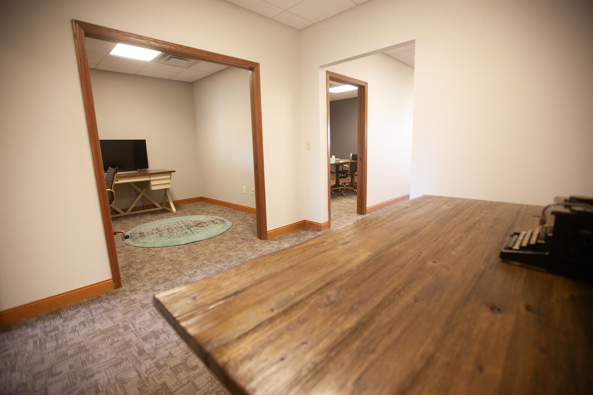 408 4th Street Moose Lake, MN 55767 - Photo 16 of 31 Empty room featuring an office area, a drop ceiling, and carpet flooring
