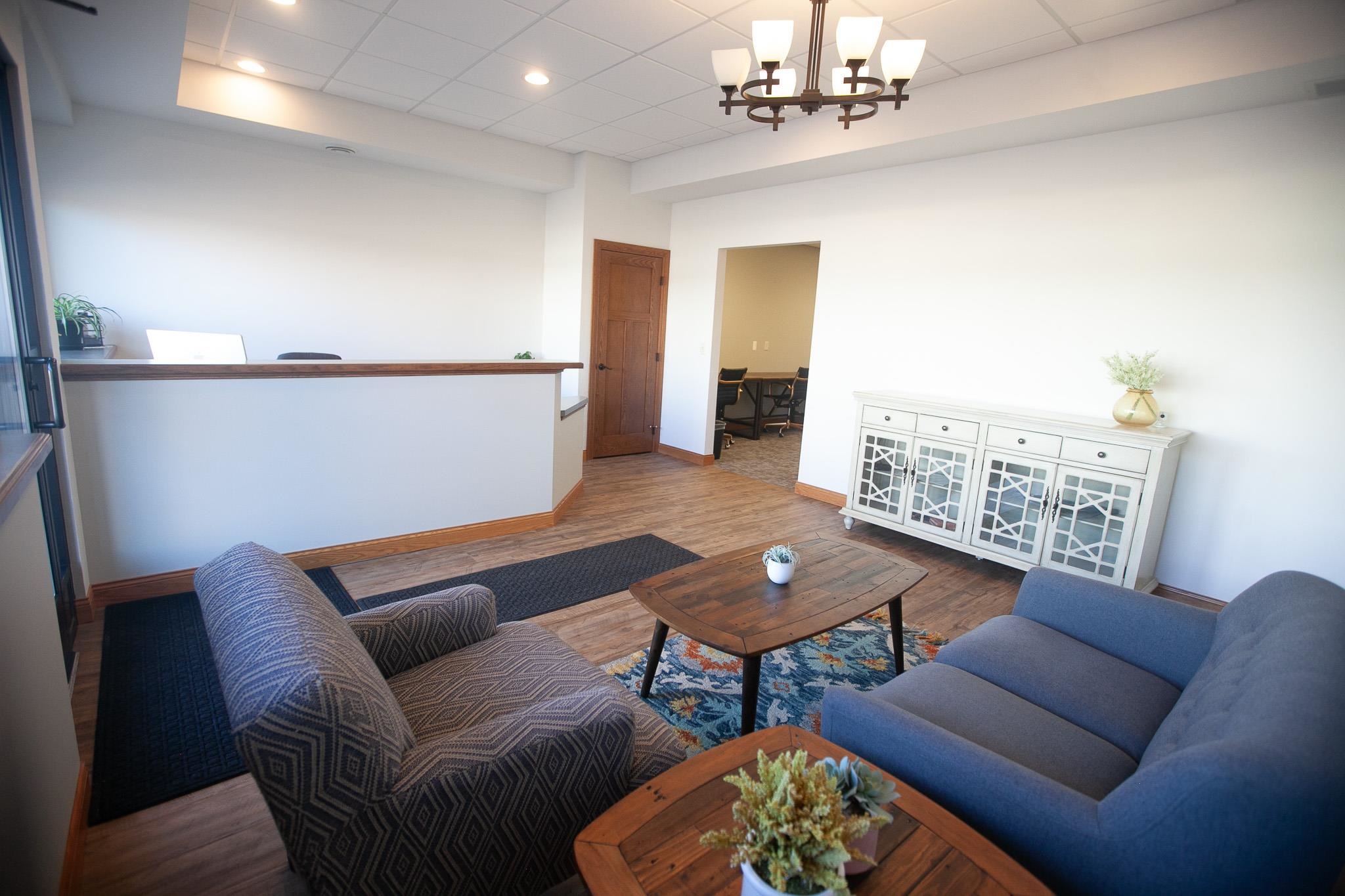 408 4th Street Moose Lake, MN 55767 - Photo 7 of 31 Living area with wood finished floors, a paneled ceiling, a chandelier, and recessed lighting