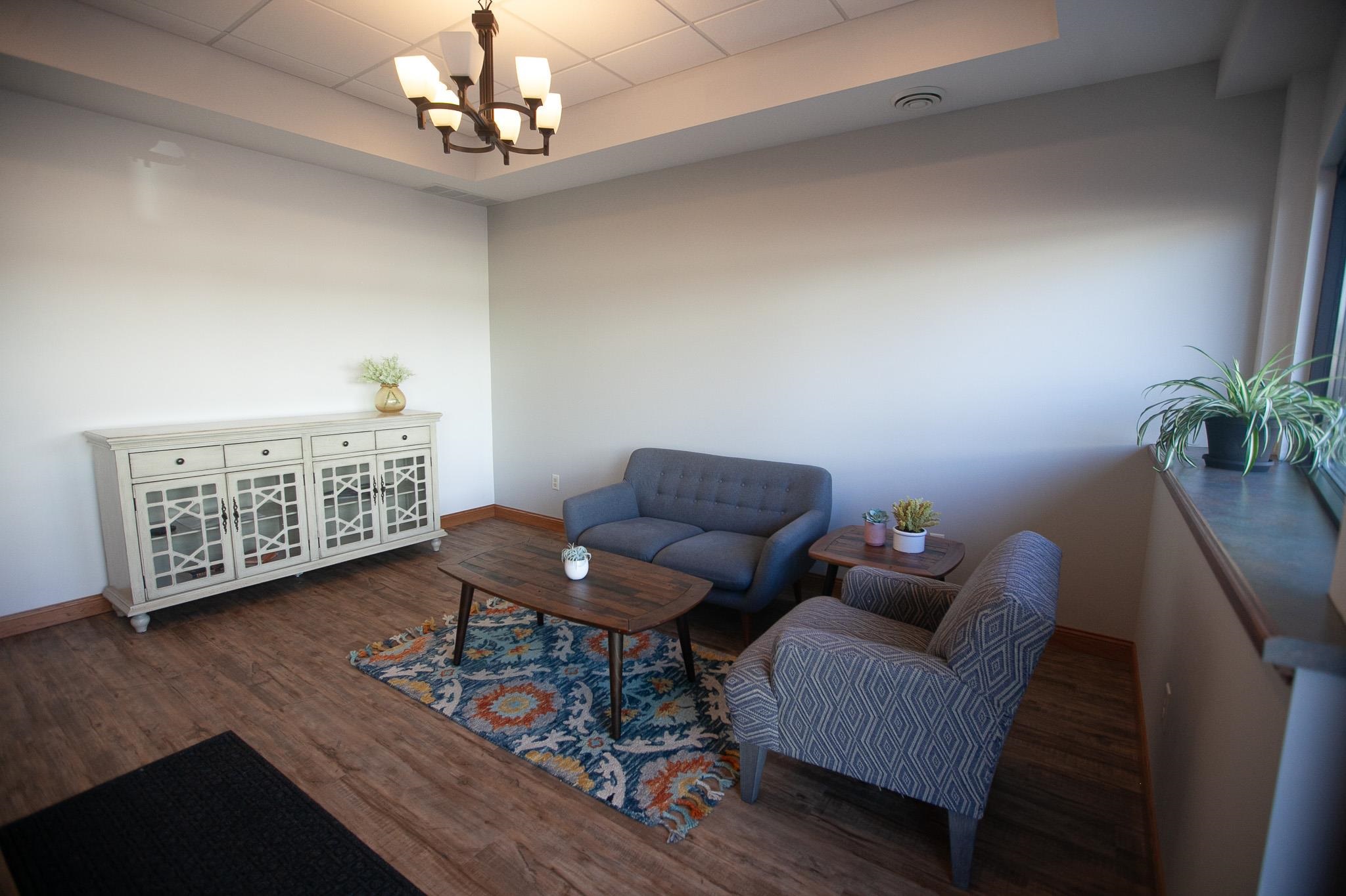 408 4th Street Moose Lake, MN 55767 - Photo 8 of 31 Sitting room with a raised ceiling, wood finished floors, a chandelier, and a drop ceiling