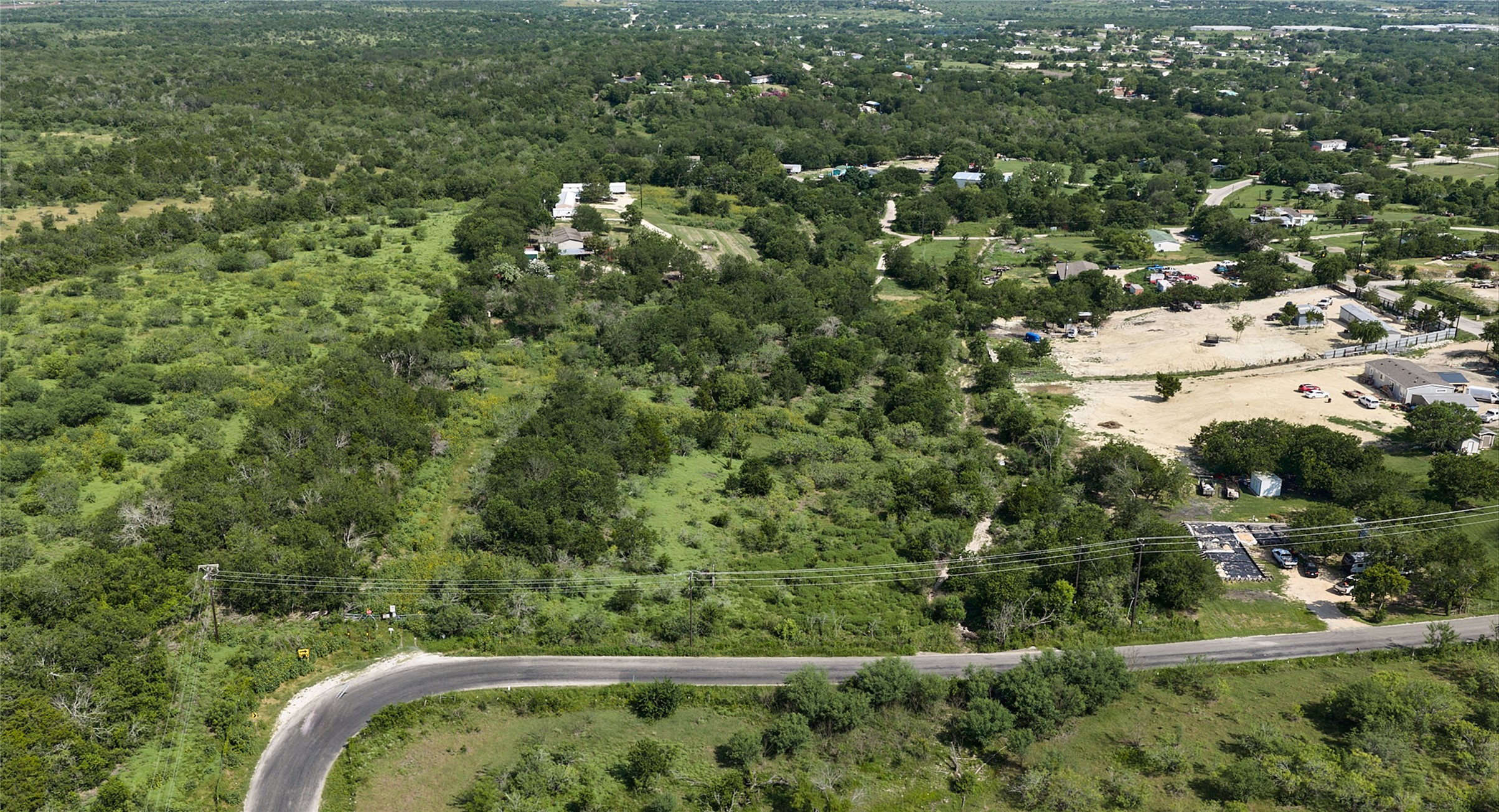 1400 Williamson Road Kyle, TX 78640 - Photo 3 of 13 Vast, verdant landscape offering privacy and room to expand.