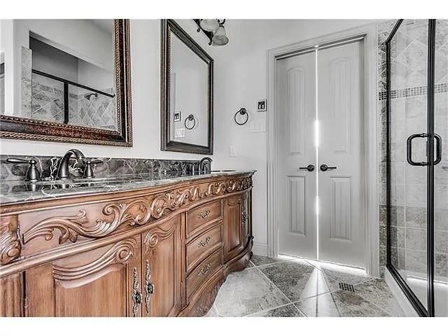 908 Lake Meadow Lane Little Elm, TX 75068 - Photo 11 of 14 a bathroom with a sink a mirror and a shower