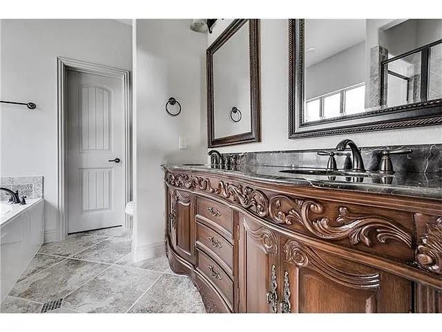 908 Lake Meadow Lane Little Elm, TX 75068 - Photo 10 of 14 a kitchen with a sink and cabinets