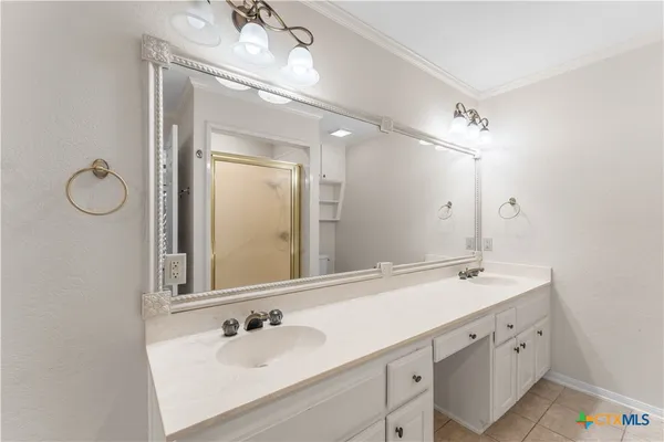a bathroom with a double vanity sink mirror and double