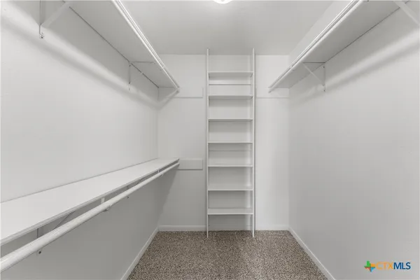 a view of an empty walk in closet
