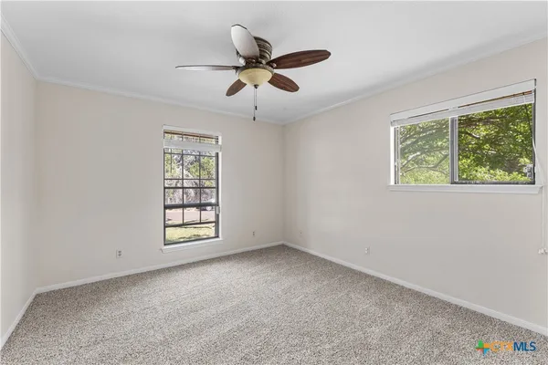 a view of an empty room with a window