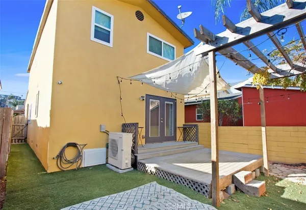 a view of a house with a sink and a yard