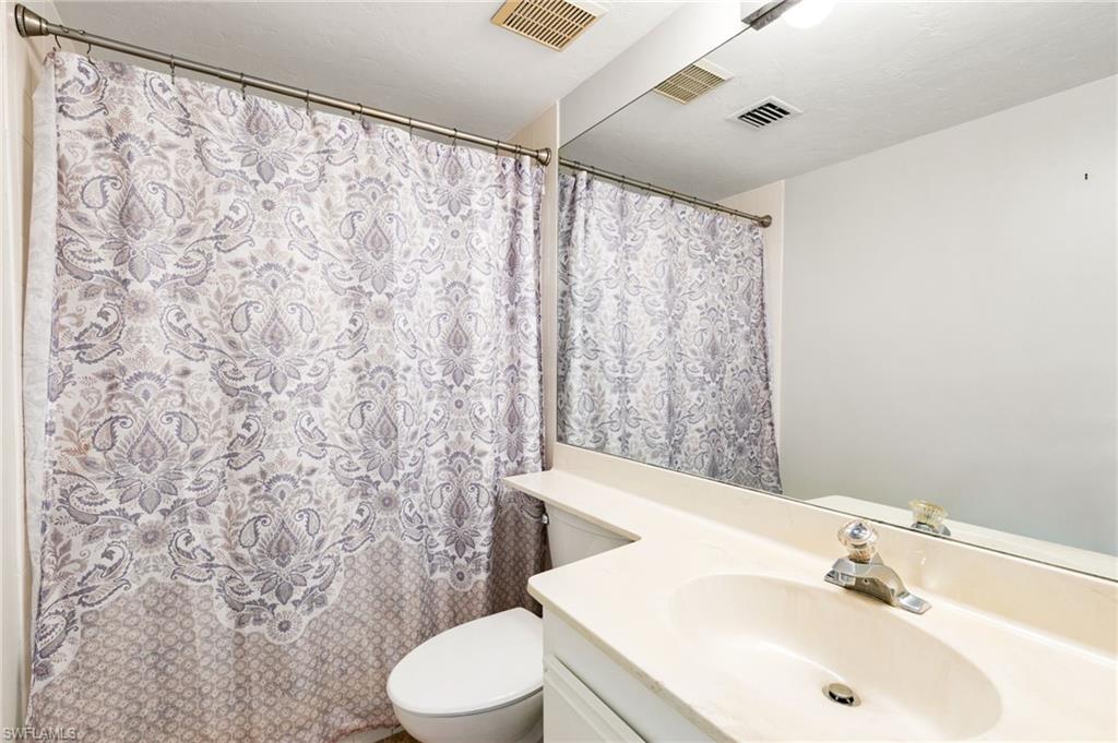 2149 San Marco Road, Unit 201 Marco Island, FL 34145 - Photo 12 of 22 a bathroom with a sink and a mirror