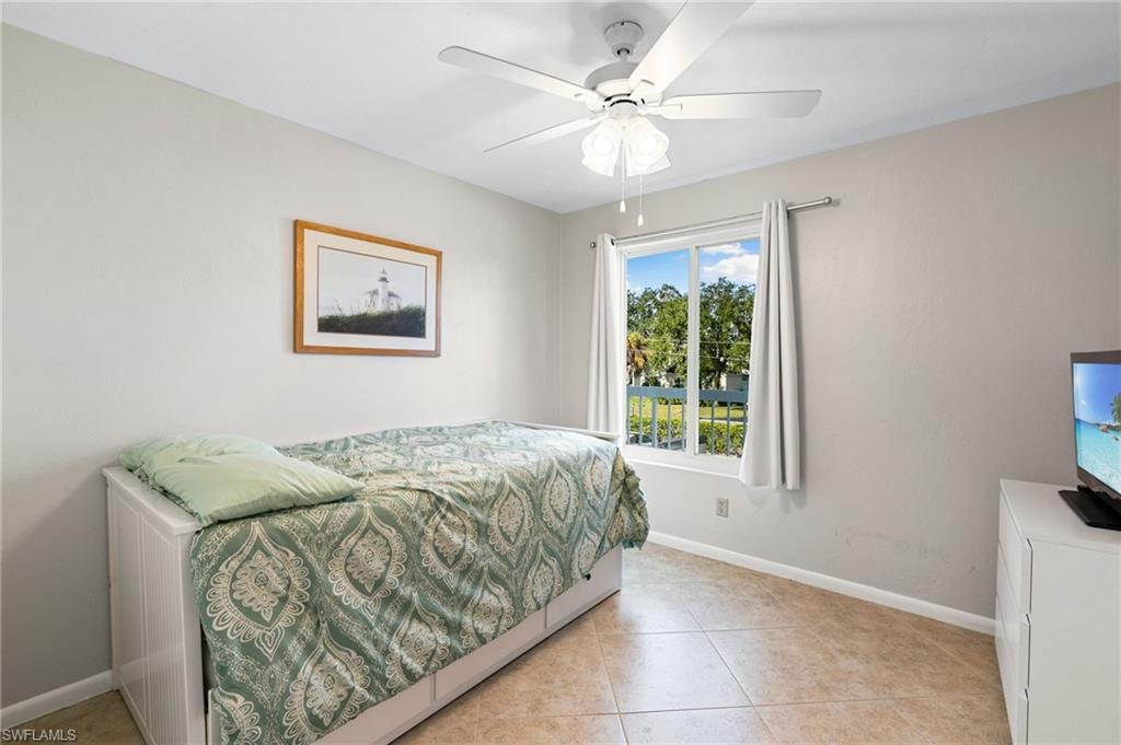 2149 San Marco Road, Unit 201 Marco Island, FL 34145 - Photo 13 of 22 a bedroom with a bed and a window
