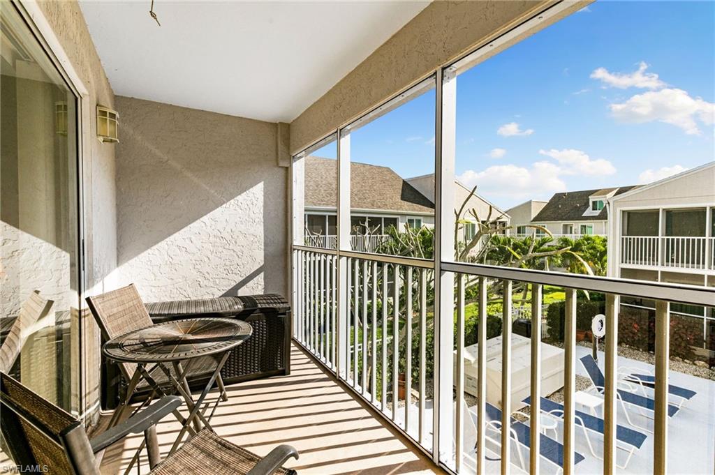 2149 San Marco Road, Unit 201 Marco Island, FL 34145 - Photo 16 of 22 a view of a balcony with chairs