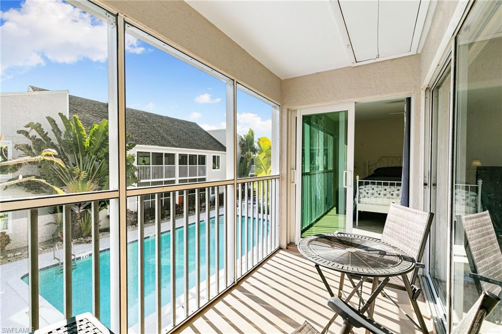 2149 San Marco Road, Unit 201 Marco Island, FL 34145 - Photo 17 of 22 a view of a balcony with chairs